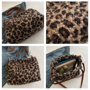 Detail of leopard print faux fur tote with leather straps and silver hardware metal rings