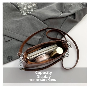 Internal view of brown PU leather shoulder bag showing capacity for phone and cosmetics