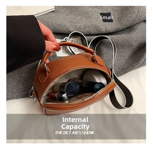 Internal view of brown litchi leather bag showing capacity for cosmetics and lipsticks