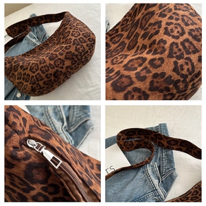 Macro details of leopard print tote bag with silver zipper and soft suede texture