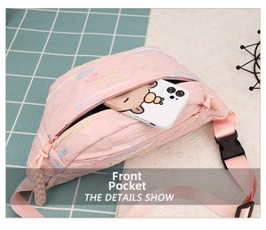 Pink quilted corduroy chest bag featuring a front zipper pocket for phone storage