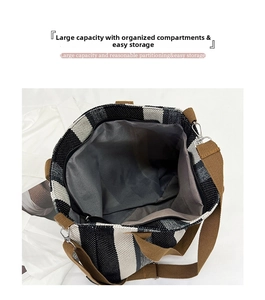Detail of striped canvas tote showing large capacity interior and durable brown straps