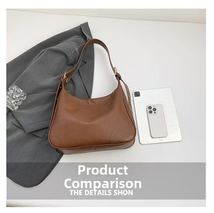 Detailed top view of a brown vintage leather hobo bag with adjustable metal buckle strap