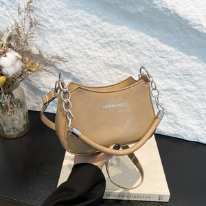 Modern khaki crescent underarm bag with thick silver chain and leather handle strap