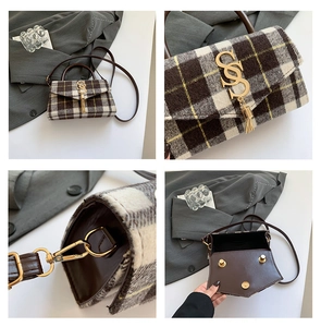Detail view of plaid handbag featuring gold SS logo, tassel accent and metal hardware
