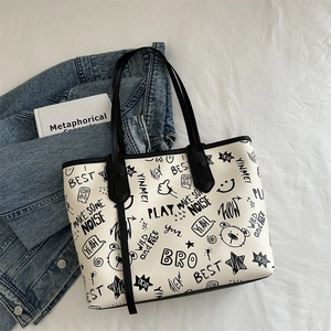 Large capacity tote bag with bear print and artistic graffiti designs on cream fabric