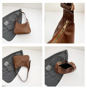Detail view of brown vintage shoulder bag showing荔枝 texture leather and gold hardware
