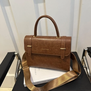 Brown vintage leather messenger bag with top handle and wide shoulder strap