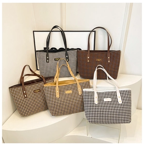 Classic houndstooth tote bags in five colors with leather handles and metallic logo detail