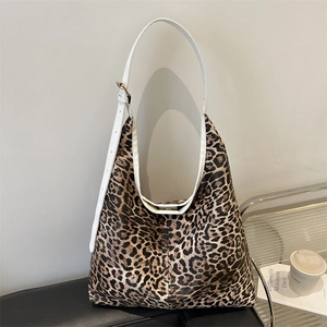 Large leopard print shoulder bag with white adjustable strap and gold metal hardware
