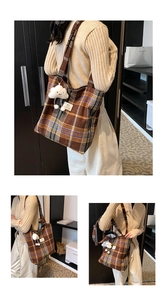 Detail of checkered tote bag with brown plaid pattern and cute cloud charm accessory
