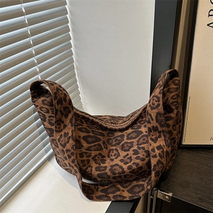 Fashionable leopard print canvas tote bag with a spacious interior and wide shoulder strap