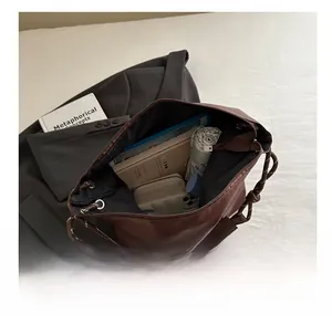 Top view of deep brown leather tote showing spacious interior for daily essentials