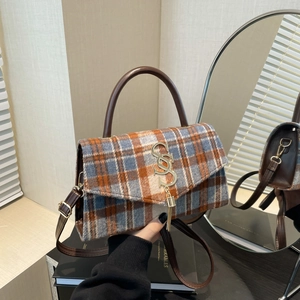 Chic plaid crossbody bag with blue and orange wool fabric and gold tassel detail