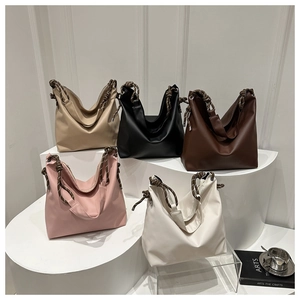 Detailed display of tote bags in five colors with unique braided rope shoulder straps