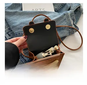 Brown crocodile pattern mini bag interior capacity for lipstick and hand cream