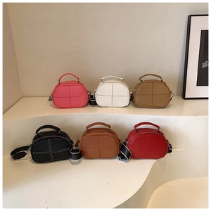 Detailed view of fashionable textured leather crossbody bags in six vibrant colors