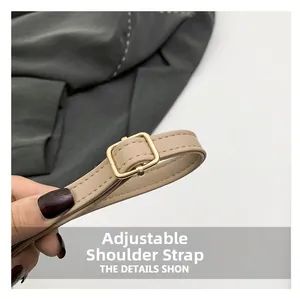 Detail of adjustable nude leather shoulder strap with a gold square buckle for handbags