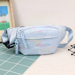Light blue corduroy dumpling bag with colorful wave embroidery and adjustable strap