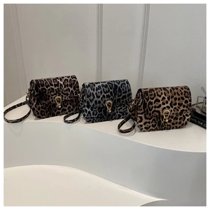 Three leopard print crossbody bags in various colors with elegant horseshoe metal buckles