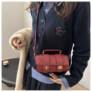 Cylindrical cherry blossom embossed leather crossbody bag in wine red with metal handles