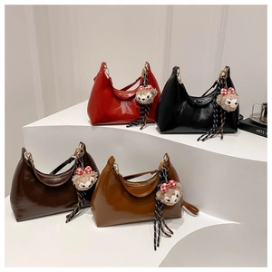 Chic oil wax leather hobo bags in four colors with plush charms and woven straps