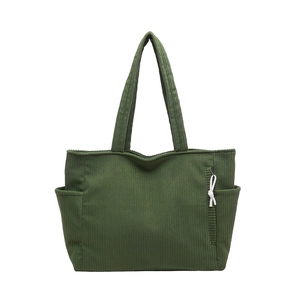 Minimalist dark green corduroy tote bag with side pockets and shoulder straps
