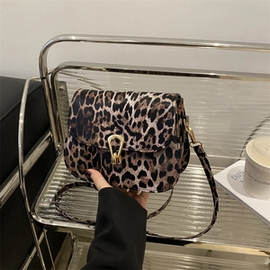 Leopard print crossbody bag with gold U-lock buckle and matching shoulder strap