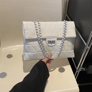 Quilted crossbody bag with silver chain strap and metal lock in cream white finish