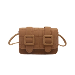 Vintage brown crossbody bag with crocodile texture and square buckles on white background