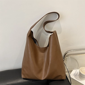 Minimalist large dark brown faux leather tote bag for women commuting in style