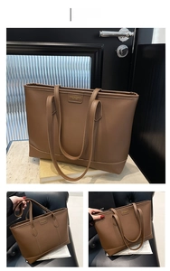 Detail einer braunen Leder-Shopper-Tasche mit geprägtem Logo und verstärktem Tragegriff