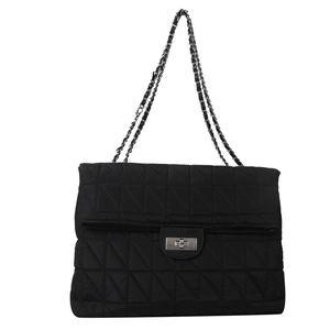 Black quilted crossbody bag with silver chain strap and metal lock in minimalist style