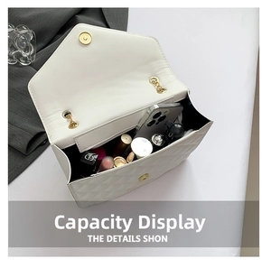 Internal view of quilted white chain bag showing storage capacity for essentials