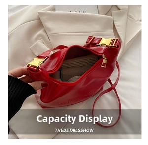 Top view of red leather shoulder bag interior showing spacious capacity for essentials