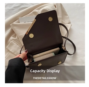Top view of retro dark brown plaid crossbody bag showing internal storage capacity
