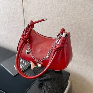 Chic burgundy crescent bag with glossy finish, silver chains and pearl charms