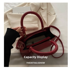 Internal structure of red PU handbag showing multi-layer storage and capacity display
