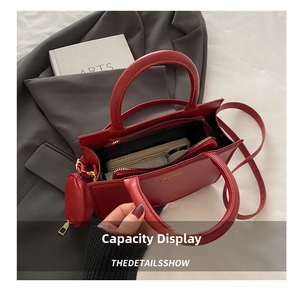 Interior view of red leather tote bag showing spacious capacity for phone and wallet