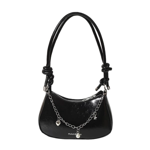 Fashionable black patent leather crescent hobo bag with decorative silver charms and chain