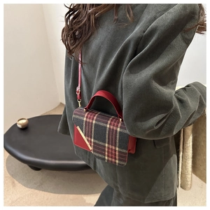 Retro plaid crossbody bag shown on model wearing a classic dark green velvet blazer