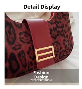 Macro shot of leopard print suede material with red leather trim and gold hardware detail