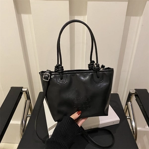 Retro black matte leather tote bag with embossed letters and stylish knot handle