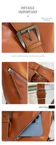 Macro shot of orange leather vintage tote details with buckles and side zippers