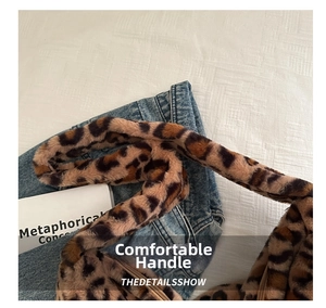 Detail of leopard print plush tote bag featuring soft faux fur texture and zipper closure
