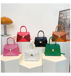 Close-up of premium crocodile pattern handbags with gold pyramid buckle in six colors
