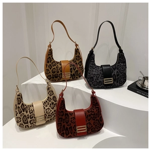 Set of four leopard print hobo bags in assorted colors with golden metallic hardware