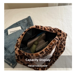 Detailed view of leopard print plush tote bag with zipper and large storage space