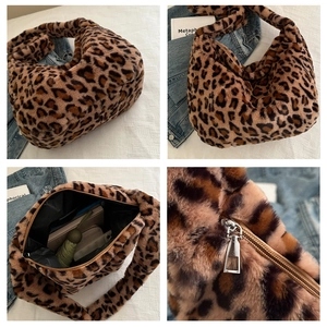 Detail view of leopard print plush tote showing spacious interior and metal zipper