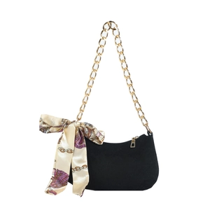 Retro black crescent underarm bag with thick gold chain and silk scarf on white background